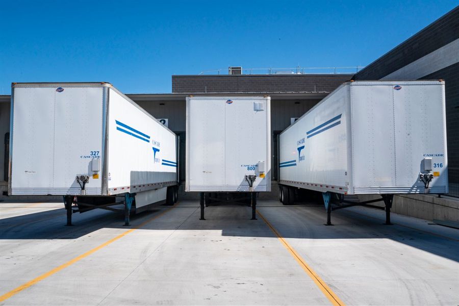 Warehouse loading docks with trailers at grade