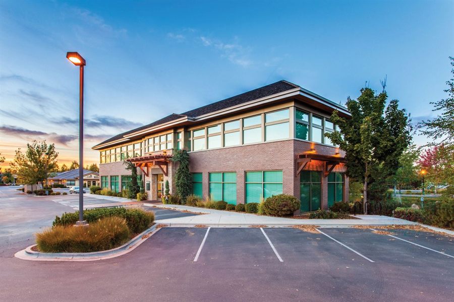 Low-rise suburban office building with surface parking